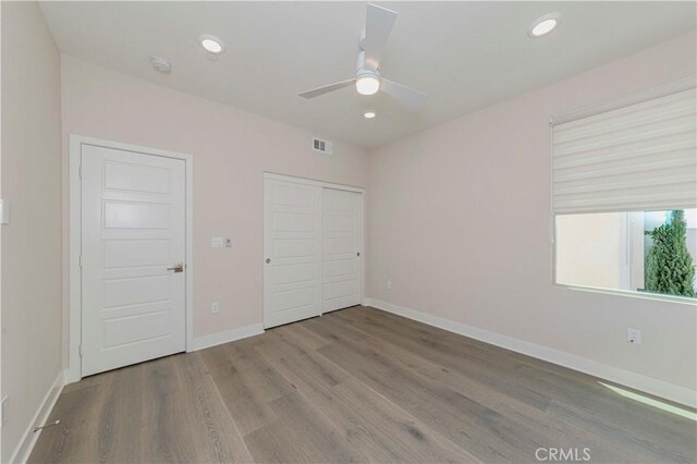 195 Stellar, Irvine, CA 92618 - unfurnished bedroom with wood finished floors, a closet, recessed lighting, and a ceiling fan