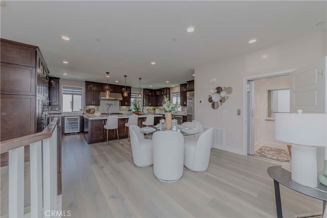 195 Stellar, Irvine, CA 92618 - dining area featuring beverage cooler, light wood finished floors, and recessed lighting