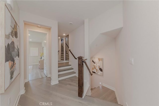 195 Stellar, Irvine, CA 92618 - stairway featuring wood finished floors and baseboards