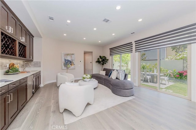 195 Stellar, Irvine, CA 92618 - living room with light wood-style floors and recessed lighting