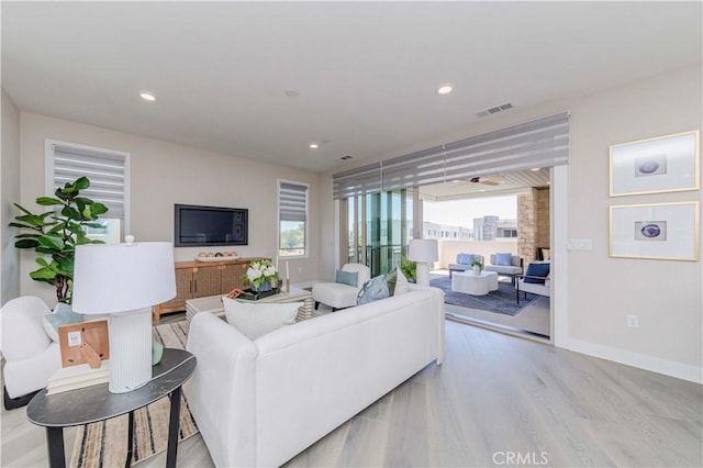 195 Stellar, Irvine, CA 92618 - living room featuring plenty of natural light, wood finished floors, and recessed lighting