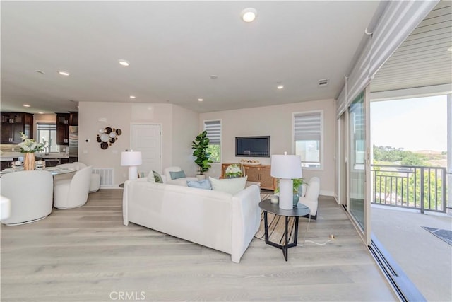 195 Stellar, Irvine, CA 92618 - living area with light wood-type flooring and recessed lighting