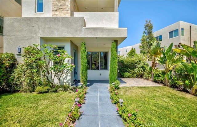 195 Stellar, Irvine, CA 92618 - entrance to property featuring a lawn and stucco siding