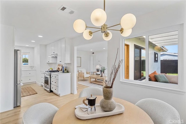 13141 Willamette St, Westminster, CA 92683 - dining area featuring light wood-style flooring, a chandelier, and recessed lighting