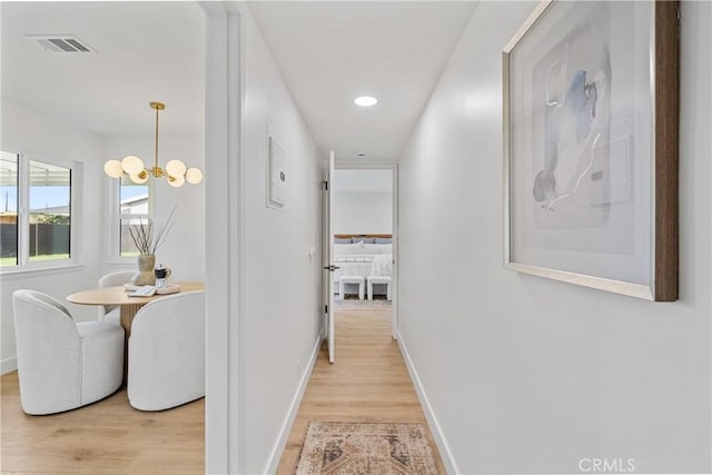 13141 Willamette St, Westminster, CA 92683 - hall with light wood-type flooring, a chandelier, and recessed lighting