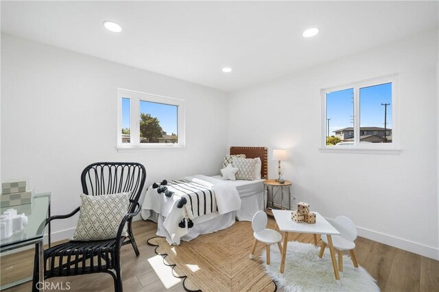 13141 Willamette St, Westminster, CA 92683 - bedroom with multiple windows, wood finished floors, and recessed lighting