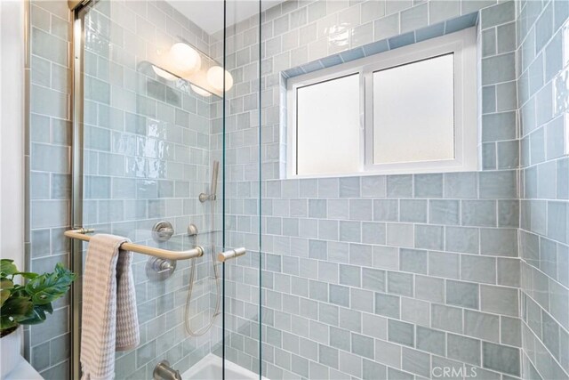 13141 Willamette St, Westminster, CA 92683 - bathroom featuring shower / bath combination with glass door