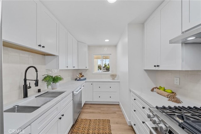 13141 Willamette St, Westminster, CA 92683 - kitchen with dishwasher, white cabinetry, light wood-type flooring, and recessed lighting