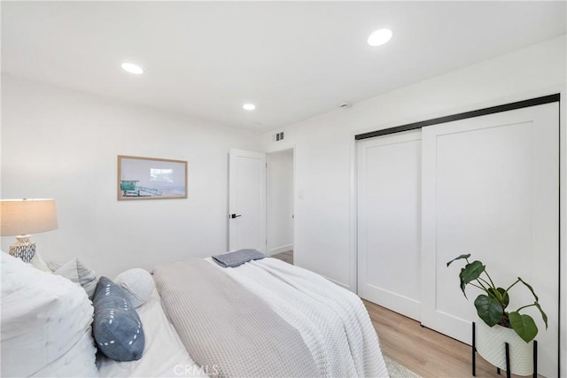 13141 Willamette St, Westminster, CA 92683 - bedroom featuring light wood finished floors, a closet, and recessed lighting