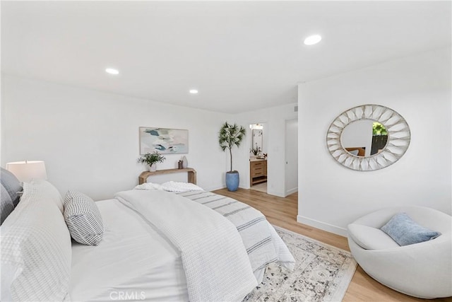 13141 Willamette St, Westminster, CA 92683 - bedroom with light wood-type flooring, recessed lighting, and ensuite bathroom