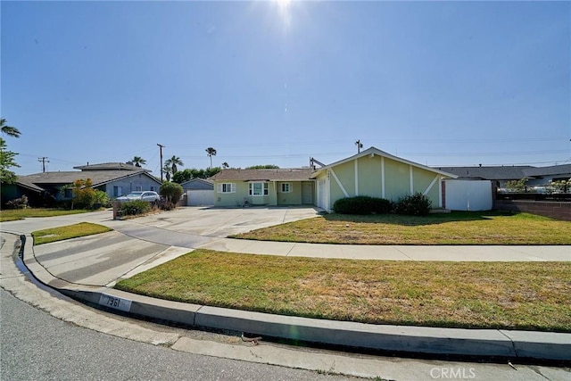 7961 La Corona Way, Buena Park, CA 90620 - view of front facade featuring a garage, concrete driveway, and a front yard