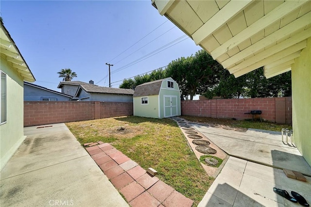 7961 La Corona Way, Buena Park, CA 90620 - fenced backyard with a patio area and a storage unit