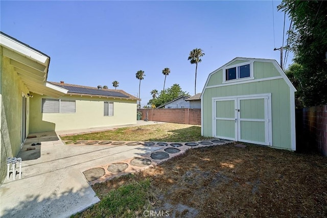 7961 La Corona Way, Buena Park, CA 90620 - fenced backyard featuring a storage unit and a patio