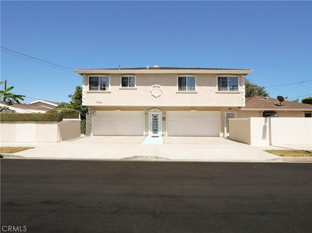 1569 W 218th St, Torrance, CA 90501 - view of front of home with stucco siding, a garage, and concrete driveway