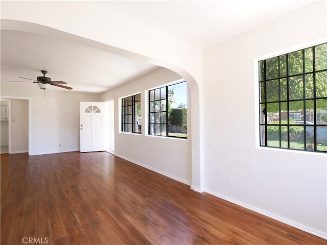 1569 W 218th St, Torrance, CA 90501 - unfurnished room with ceiling fan, arched walkways, and wood finished floors