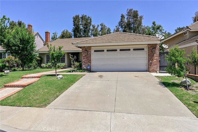 777 Oak Knoll St, Brea, CA 92821 - ranch-style house with concrete driveway, a front yard, an attached garage, brick siding, and a tile roof