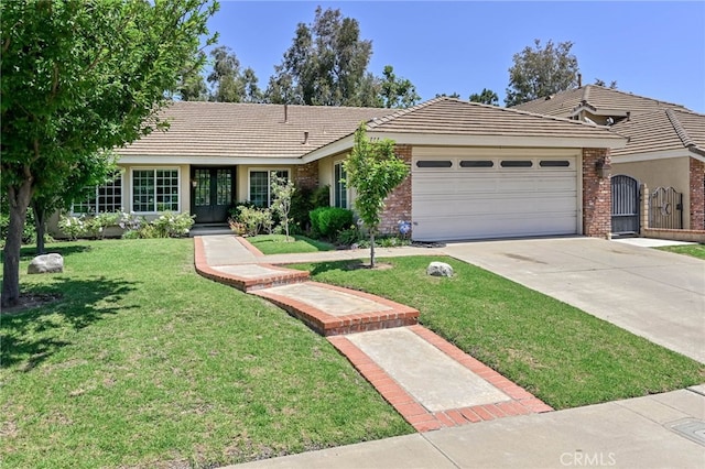 777 Oak Knoll St, Brea, CA 92821 - ranch-style house featuring an attached garage, a front lawn, concrete driveway, and brick siding