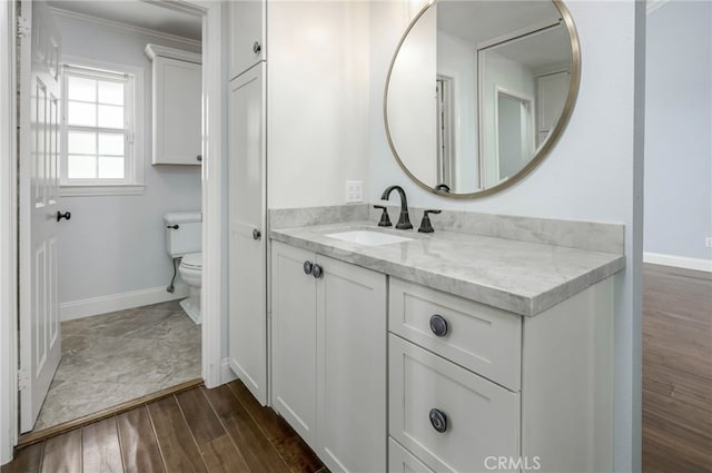 777 Oak Knoll St, Brea, CA 92821 - bathroom with vanity, wood finished floors, and ornamental molding