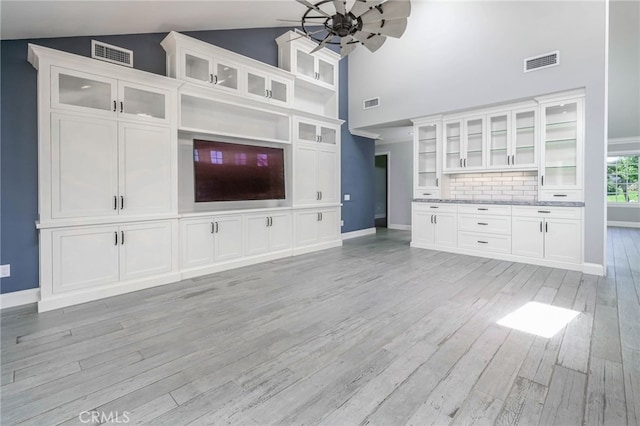 777 Oak Knoll St, Brea, CA 92821 - unfurnished living room featuring light wood-style flooring, a ceiling fan, and high vaulted ceiling