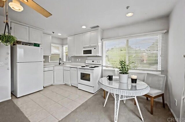 10160 Vista De La Cruz Ln, Mesa, CA 91941 - kitchen with white appliances, white cabinetry, recessed lighting, light countertops, and light tile patterned flooring