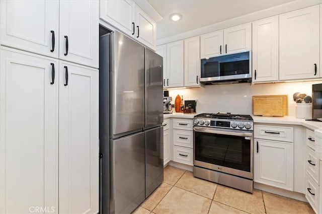 1151 Veramar Ct Unit 101, Corona, CA 92882 - kitchen featuring appliances with stainless steel finishes, light tile patterned floors, light countertops, white cabinetry, and recessed lighting