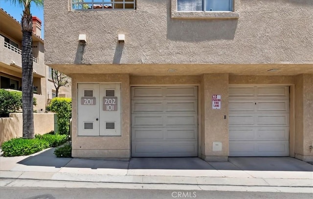 1151 Veramar Ct Unit 101, Corona, CA 92882 - property entrance featuring stucco siding and an attached garage