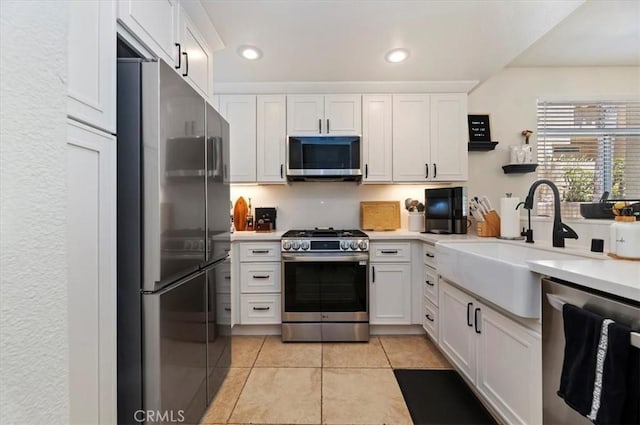 1151 Veramar Ct Unit 101, Corona, CA 92882 - kitchen with stainless steel appliances, white cabinets, light countertops, light tile patterned flooring, and recessed lighting