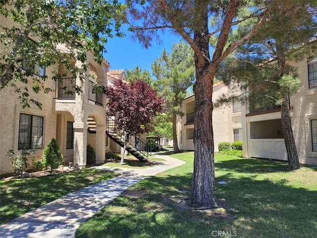 2554 Olive Dr Unit 98, Palmdale, CA 93550 - view of home's community with stairs and a lawn