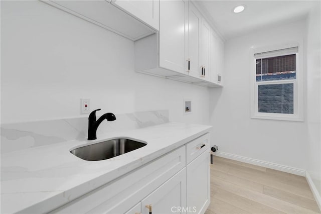 1541 2nd St, Duarte, CA 91010 - laundry area featuring washer hookup, cabinet space, light wood-type flooring, and recessed lighting