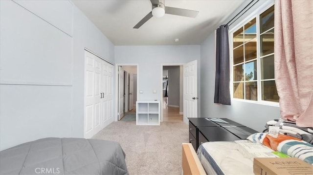 13849 Jackson St, Oak Hills, CA 92344 - bedroom with light colored carpet, a closet, and ceiling fan