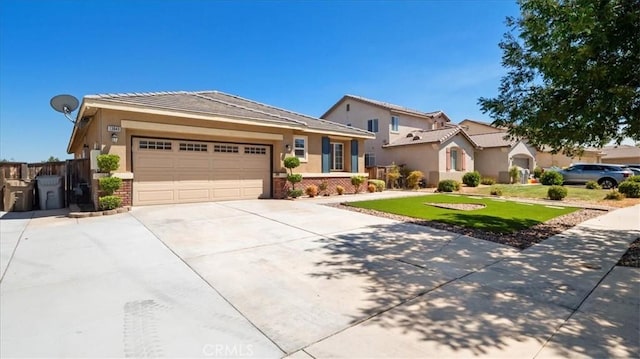 13849 Jackson St, Oak Hills, CA 92344 - view of front facade featuring driveway, an attached garage, brick siding, and stucco siding