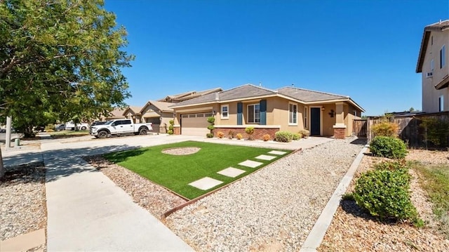 13849 Jackson St, Oak Hills, CA 92344 - view of front facade featuring stucco siding, concrete driveway, and an attached garage