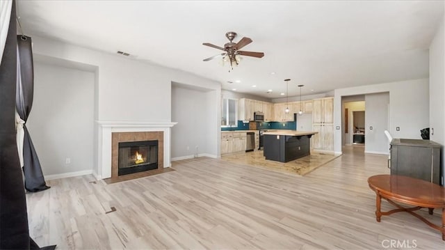 13849 Jackson St, Oak Hills, CA 92344 - living room with ceiling fan, light wood-style floors, recessed lighting, and a fireplace