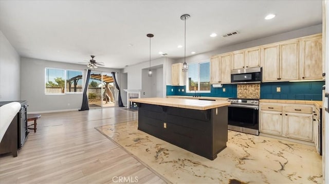 13849 Jackson St, Oak Hills, CA 92344 - kitchen featuring stainless steel appliances, tile countertops, light brown cabinetry, decorative backsplash, and plenty of natural light