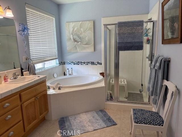 384 Papst Ave, Orland, CA 95963 - bathroom featuring vanity, a garden tub, tile patterned floors, and a shower stall