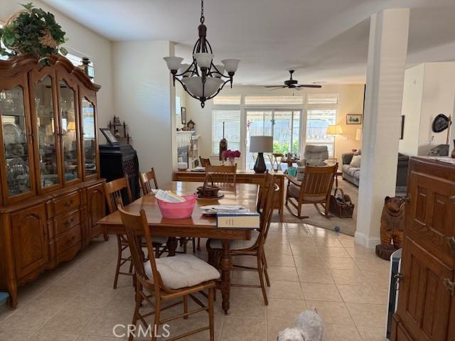 384 Papst Ave, Orland, CA 95963 - dining area featuring light tile patterned floors, a chandelier, and ceiling fan