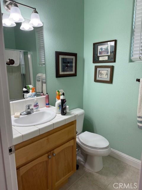 384 Papst Ave, Orland, CA 95963 - full bath with vanity, tile patterned floors, a shower stall, and a chandelier