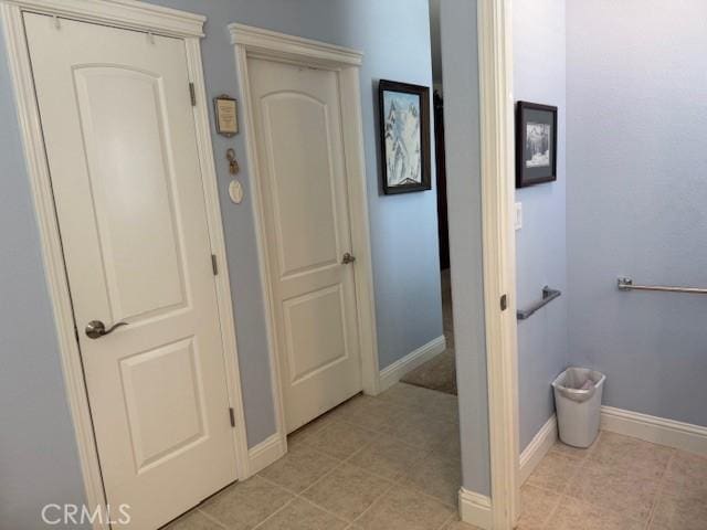 384 Papst Ave, Orland, CA 95963 - corridor featuring baseboards and light tile patterned floors