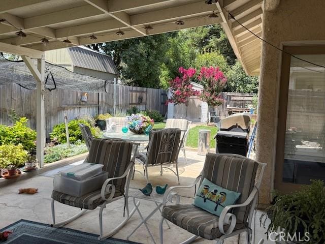 384 Papst Ave, Orland, CA 95963 - fenced backyard featuring a patio, outdoor dining space, and area for grilling