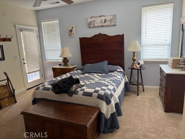 384 Papst Ave, Orland, CA 95963 - bedroom with light colored carpet, multiple windows, and a ceiling fan