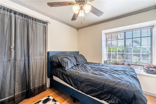 625 Balboa Dr, Corona, CA 92879 - bedroom with wood finished floors, ornamental molding, and ceiling fan