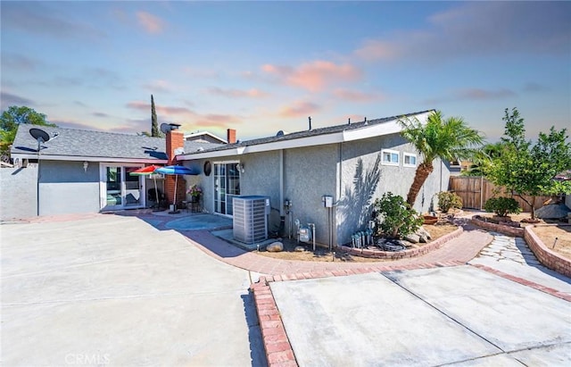 625 Balboa Dr, Corona, CA 92879 - rear view of house with a patio area, stucco siding, and a chimney
