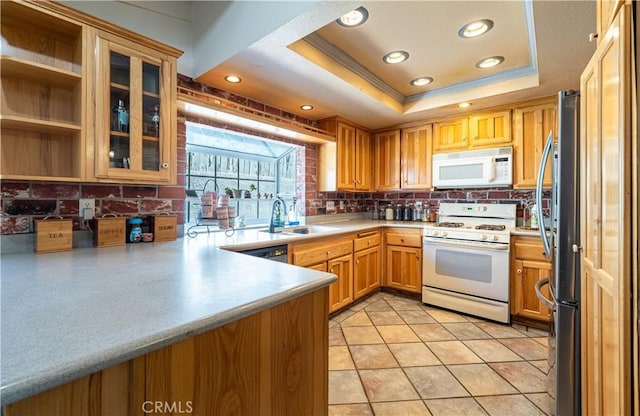 625 Balboa Dr, Corona, CA 92879 - kitchen featuring white appliances, decorative backsplash, crown molding, a tray ceiling, and light countertops