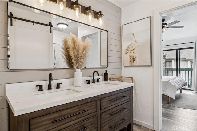 2444 La Costa Ct, Oceano, CA 93445 - full bath with double vanity, wood finished floors, ceiling fan, and connected bathroom