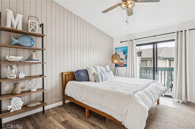 2444 La Costa Ct, Oceano, CA 93445 - bedroom with wood finished floors, access to outside, vaulted ceiling, wood walls, and a ceiling fan