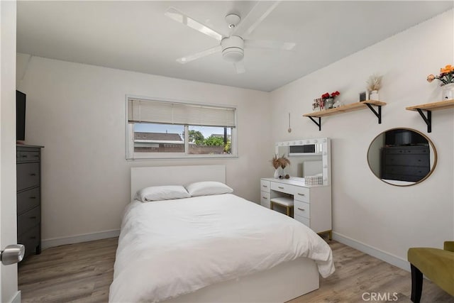 2816 E Alden Pl, Anaheim, CA 92806 - bedroom with light wood finished floors and ceiling fan
