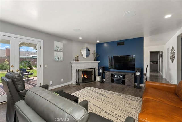 2816 E Alden Pl, Anaheim, CA 92806 - living room featuring wood finished floors, french doors, a fireplace, and recessed lighting