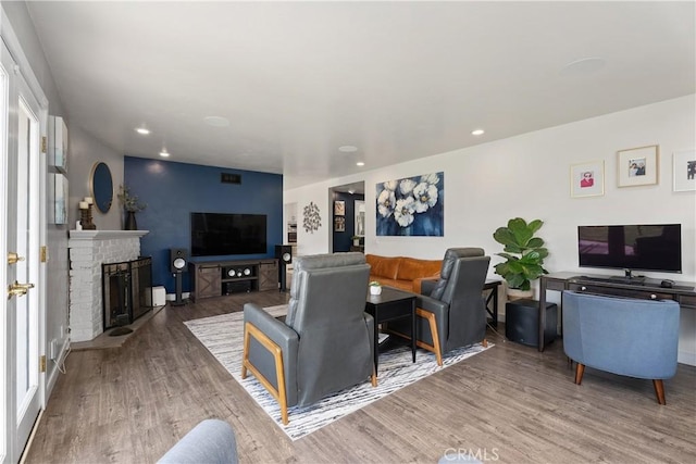 2816 E Alden Pl, Anaheim, CA 92806 - living room with wood finished floors, a brick fireplace, and recessed lighting