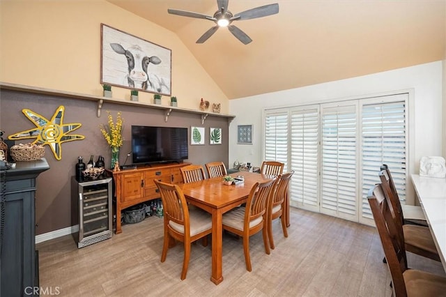 26309 Emerald Dove Dr, Valencia, CA 91355 - dining room featuring beverage cooler, ceiling fan, light wood-style floors, and high vaulted ceiling