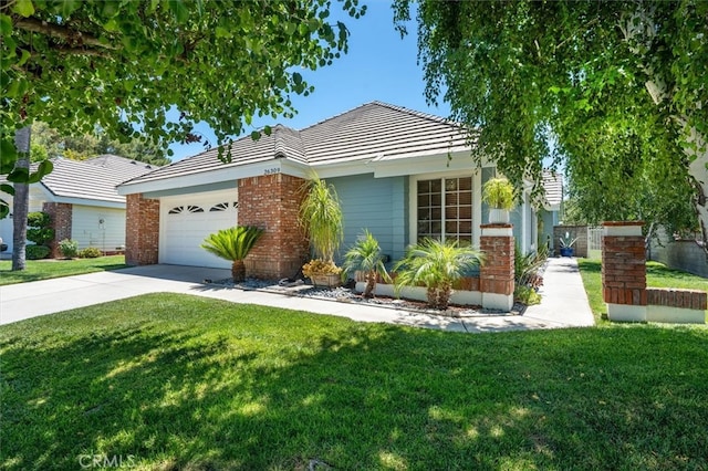 26309 Emerald Dove Dr, Valencia, CA 91355 - view of front of house featuring concrete driveway, an attached garage, a tile roof, and brick siding